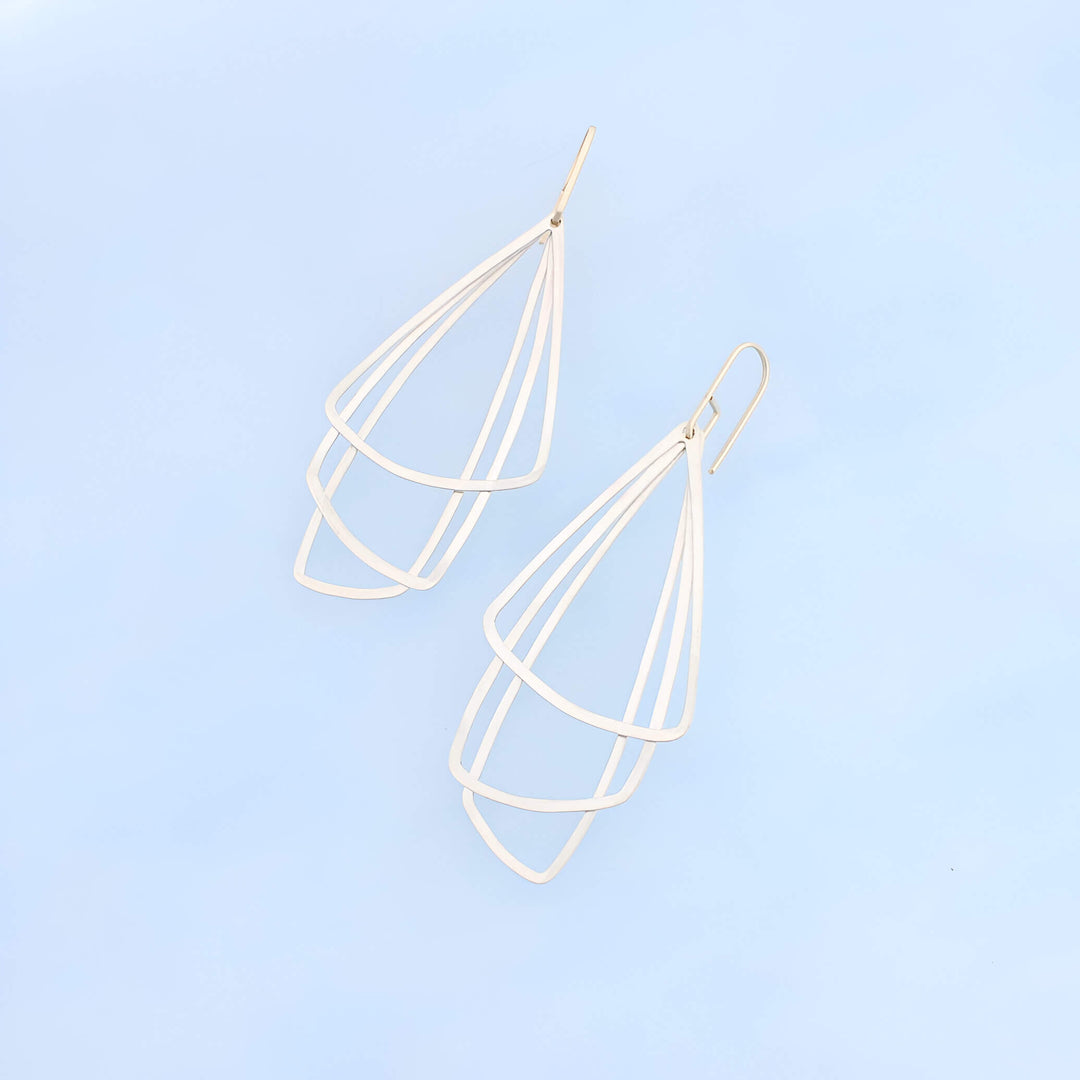 Art Deco inspired sterling silver dangle earrings with three silver triangles and 14k gold ear wires.