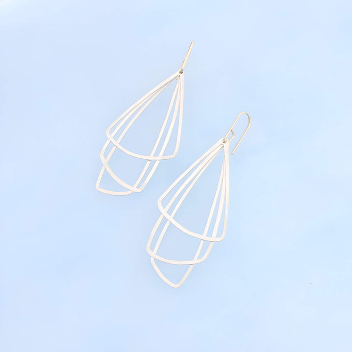 Art Deco inspired sterling silver dangle earrings with three silver triangles and 14k gold ear wires.