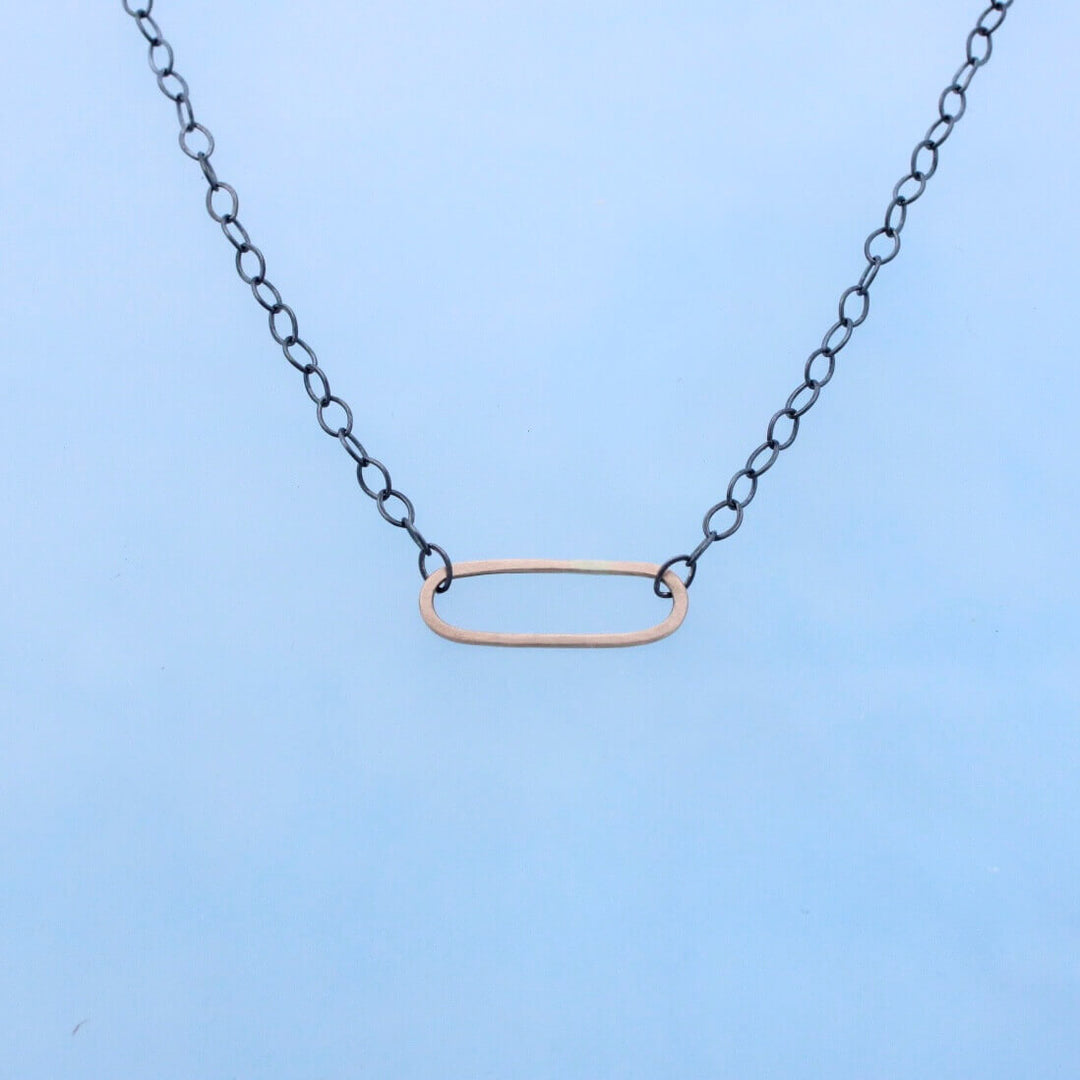 Modern mixed metal necklace oxidized silver chain with 14k gold oval  from Embody series Balance