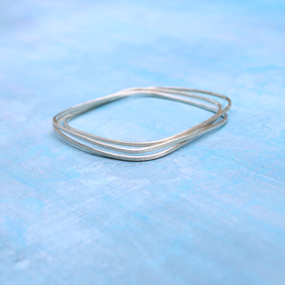 geometric bangle set of 3 intertwined square bangles