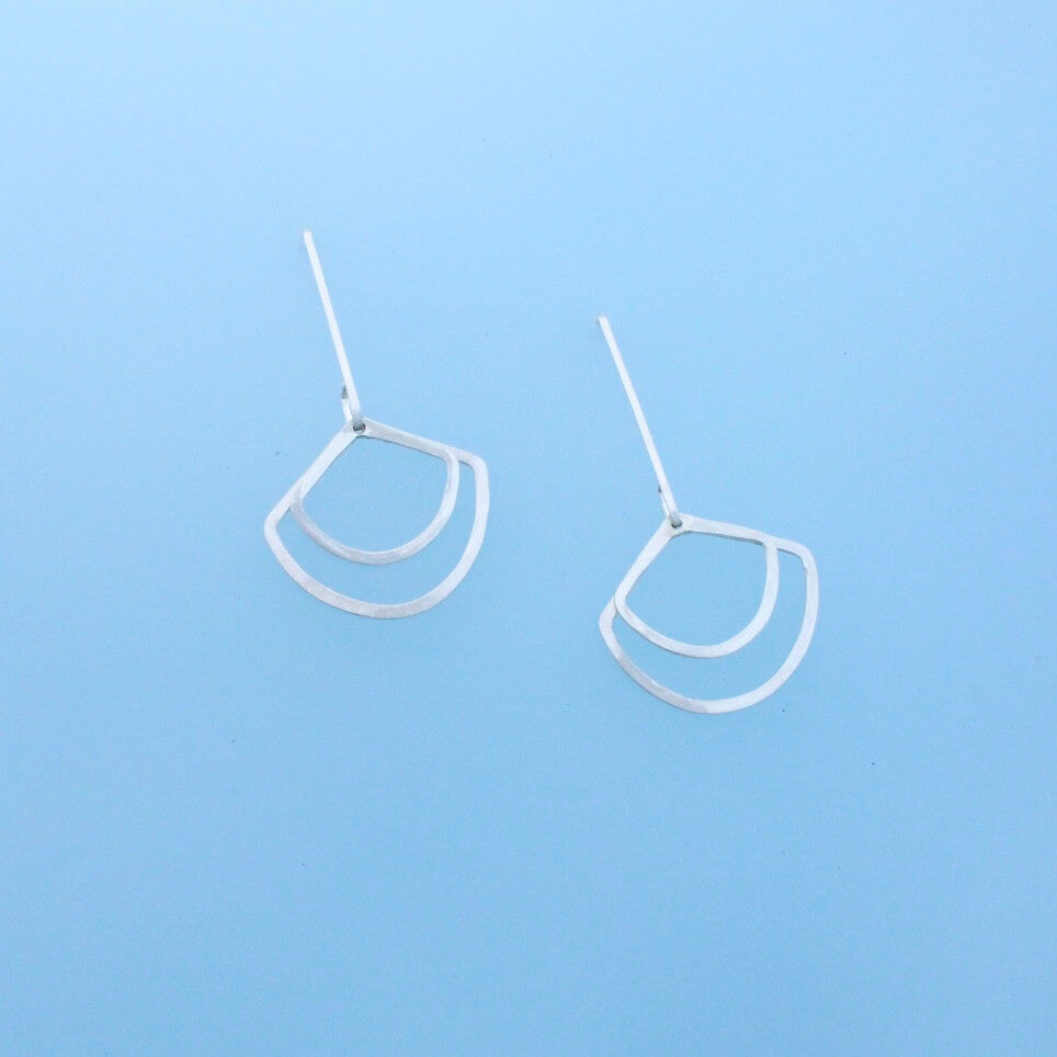 Minimalist dangles one inch earwires with two hanging geometric dangles in the shape of fans.