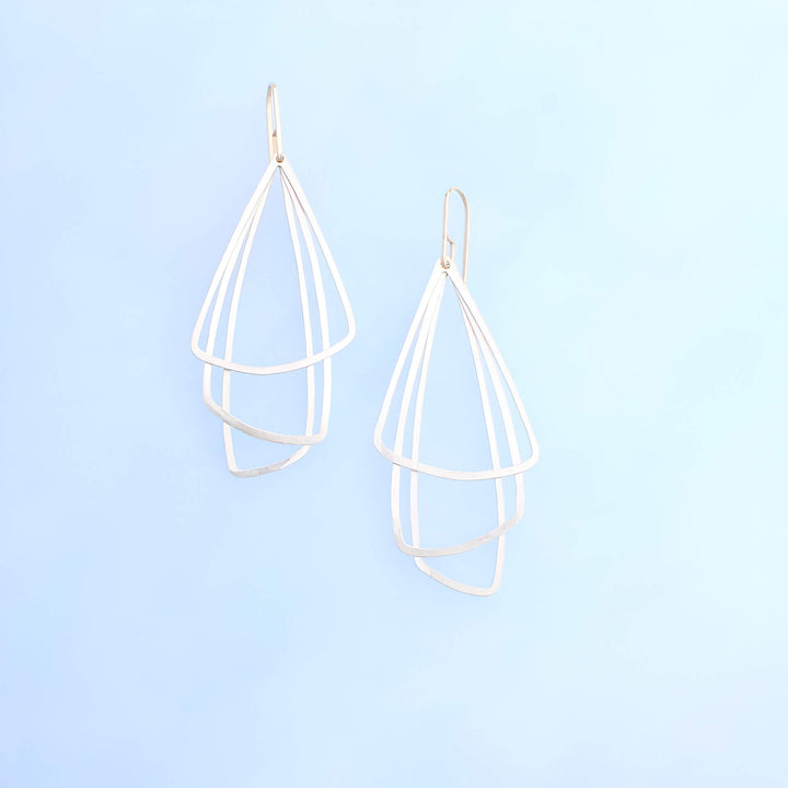 three sterling silver triangles layered and free hanging with  14k gold ear wires